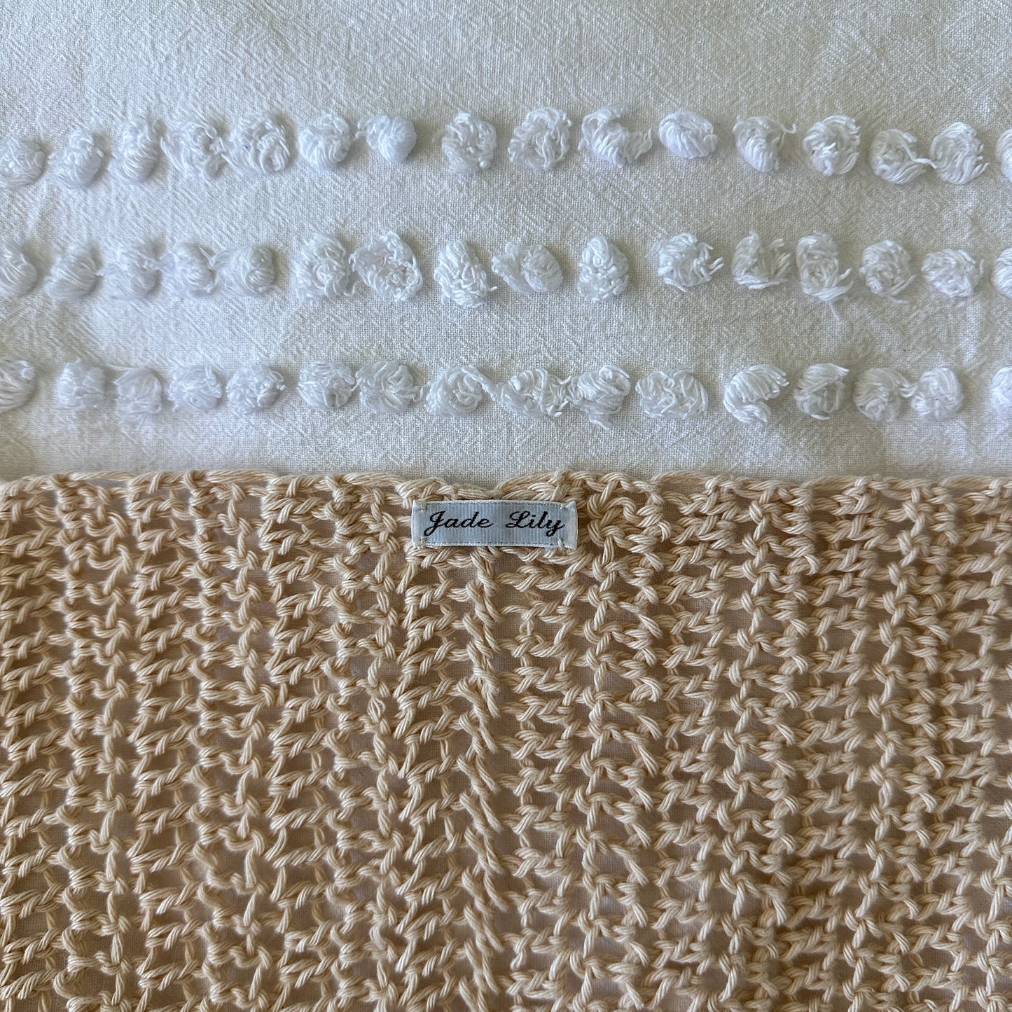 Crochet poncho with a label on a white background